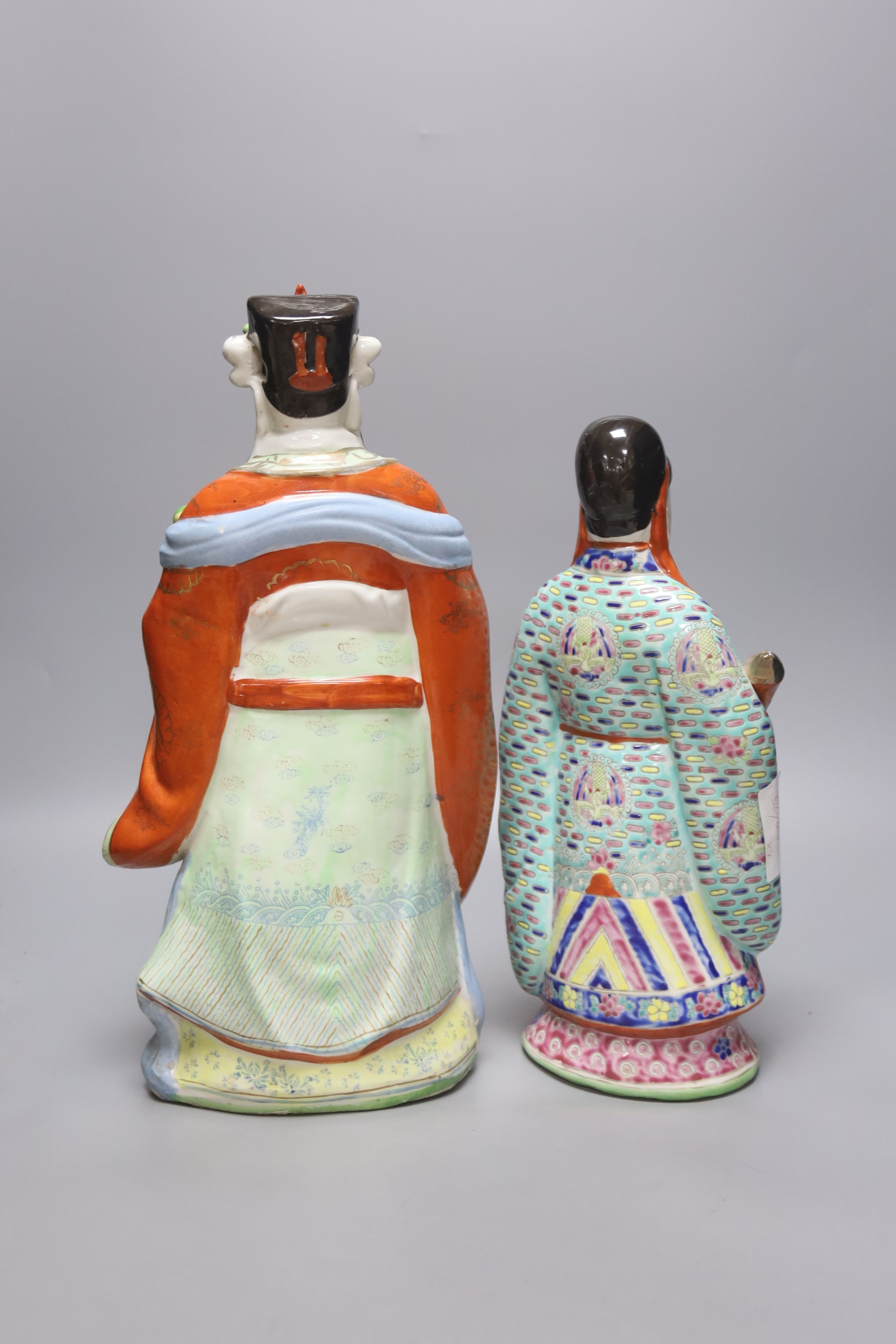 Four 20th century earthenware Chinese figures, tallest 39cm